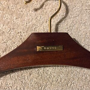 Gucci Mahogany Hanger with Gold Detail